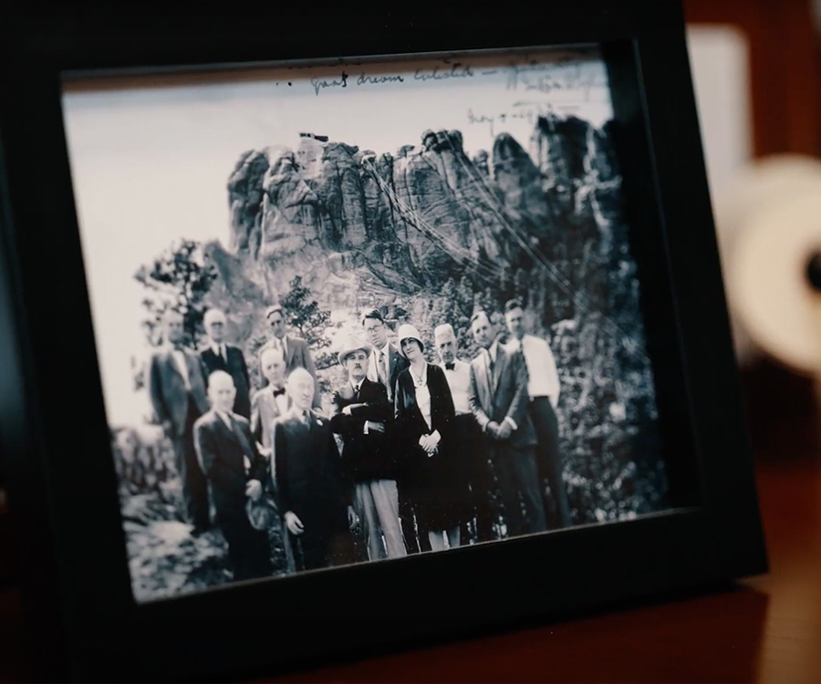 A historic photo of CorTrust founders in front of mount rushmore
