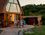 A group gathers outside their home for a dinner under the stars