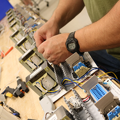 A PTS Products employee assembles parts to streamline the manufacturing process for companies around the world.