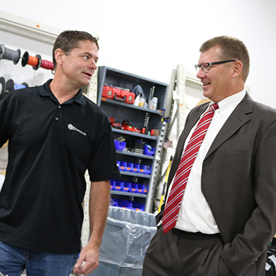 PTS Products President Paul Soberg talks through a new product with CorTrust Bank Vice President Paul Stecker.