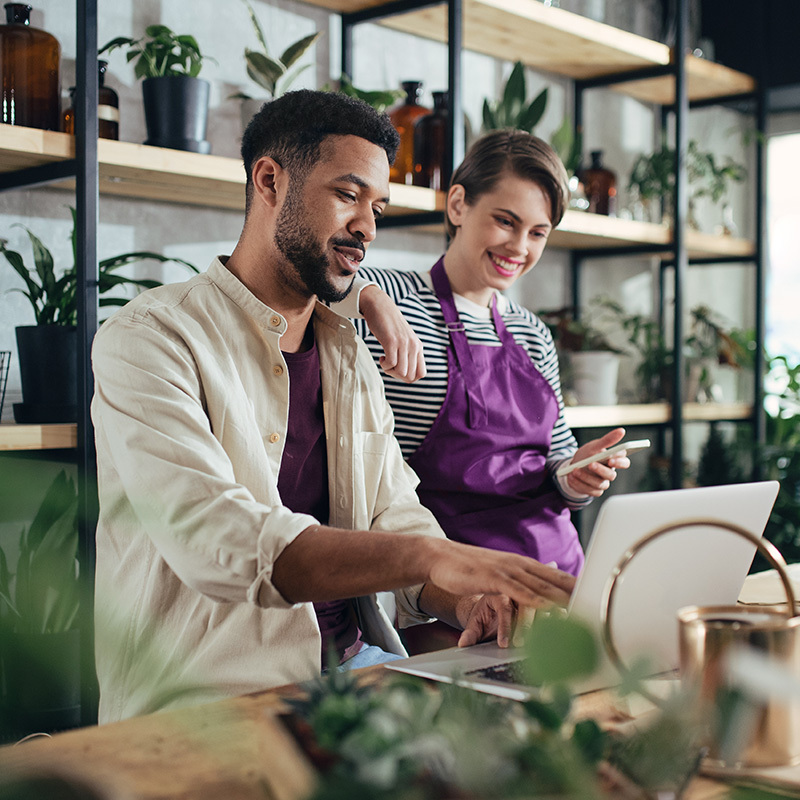 Two business owners check out their laptop